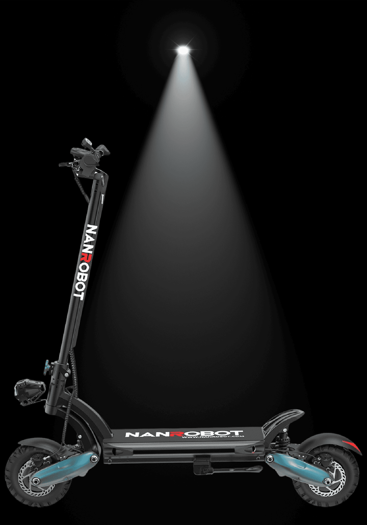 Nanrobot D6+ electric scooter illuminated by overhead light against a dark background.