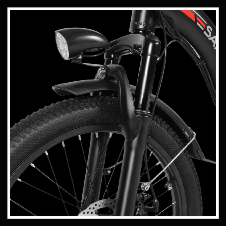 Close-up of SAMEBIKE CY20 front fork, showcasing the light and tire, highlighting its durable design.