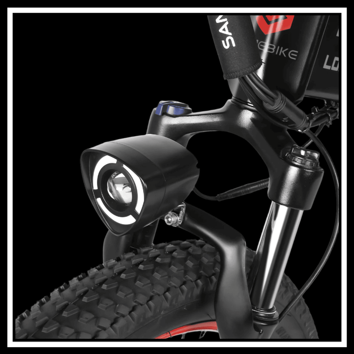 Front light and suspension fork of 🇮🇪🇪🇺🇬🇧 SAMEBIKE LO26 PLUS 1000W electric bike showcasing rugged design.