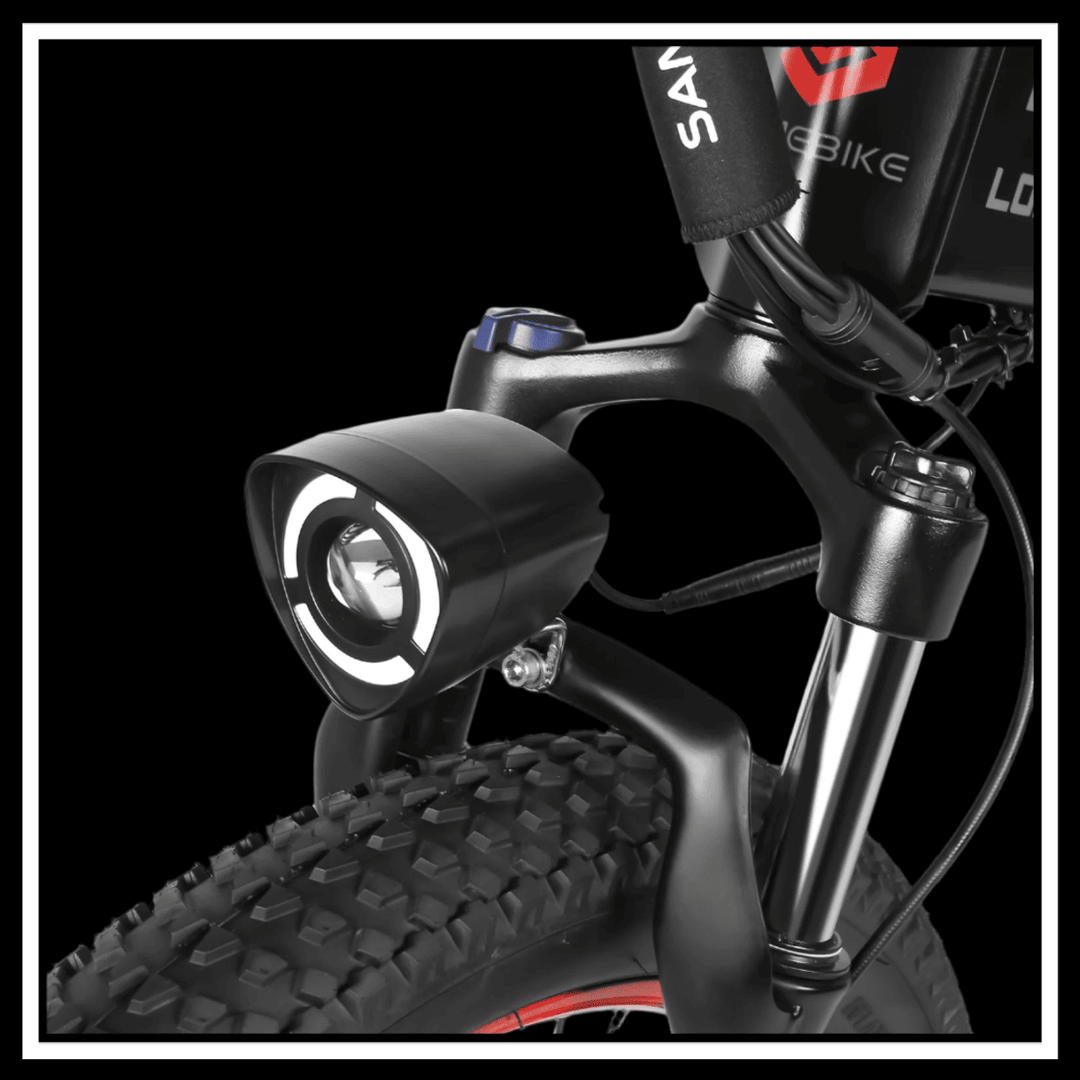 Front light and suspension fork of 🇮🇪🇪🇺🇬🇧 SAMEBIKE LO26 PLUS 1000W electric bike showcasing rugged design.