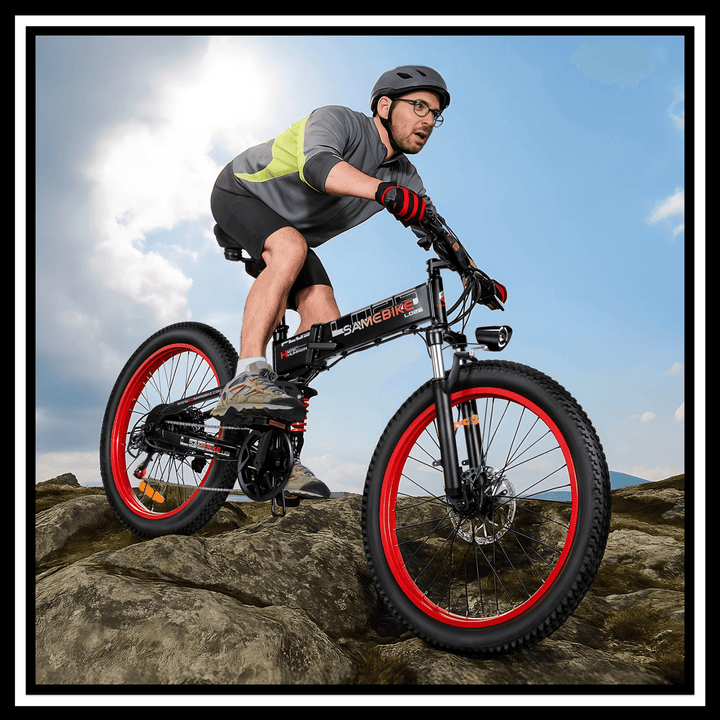 Samebike LO26 Plus 1000W electric bike in action on rocky terrain with rider.