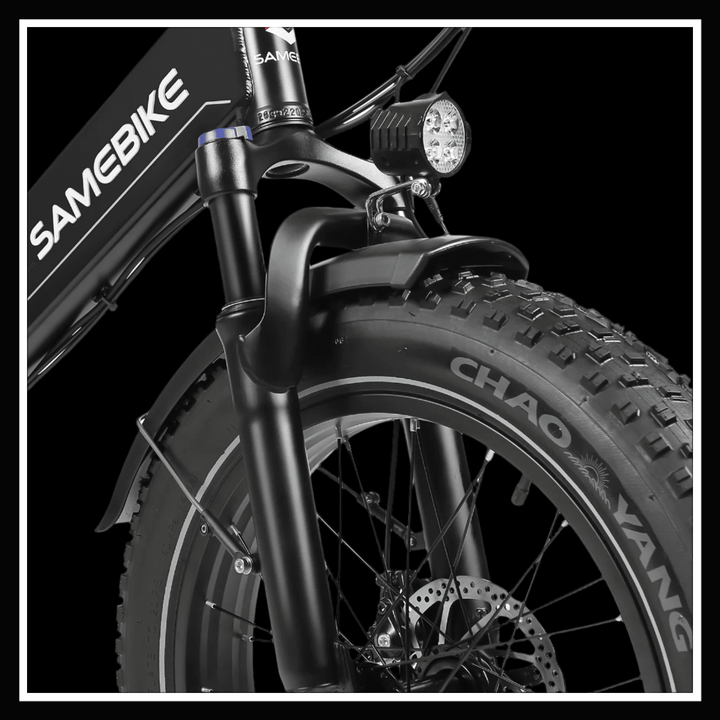 Front fork and tire of SAMEBIKE LOTDM200 II electric bike with headlight highlighting its design.