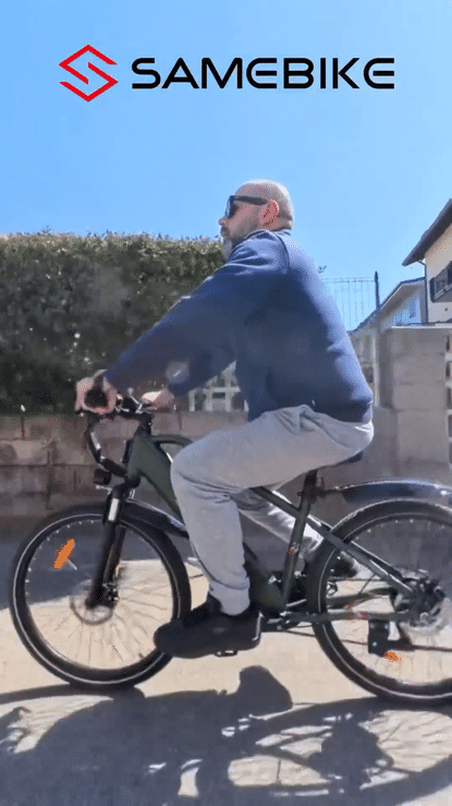 SAMEBIKE RS-A01 MEN ELECTRIC BIKE in action on city streets with a cyclist riding comfortably.