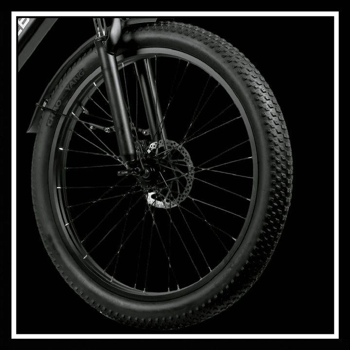 Close-up of the front wheel of SAMEBIKE RS-A01 PLUS electric bike showcasing tire and brake details.