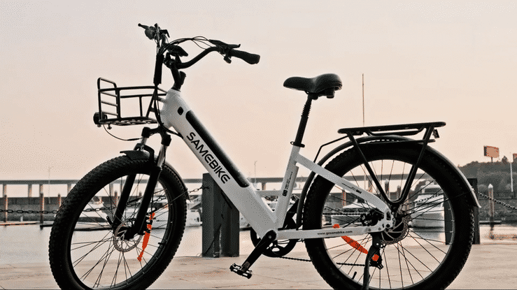 Samebike RS-A01 PLUS electric city bike parked near the waterfront at sunset, showcasing its sleek design and sturdy frame.