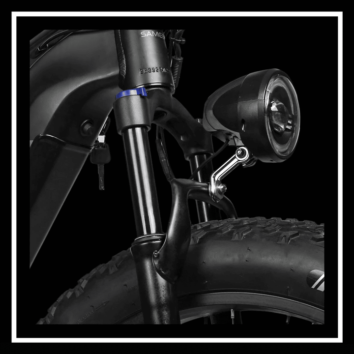 Detail of the SAMEBIKE RSA08-II ELECTRIC BIKE showcasing the suspension fork and front light.