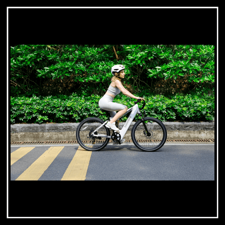 Woman riding the 🇮🇪🇪🇺🇺🇸🇬🇧 SAMEBIKE XD26-II electric bike on a bike-friendly road.