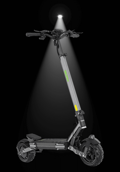 VIPCOO VS6 ELECTRIC SCOOTER illuminated in a dark environment, showcasing its sleek design and powerful features.