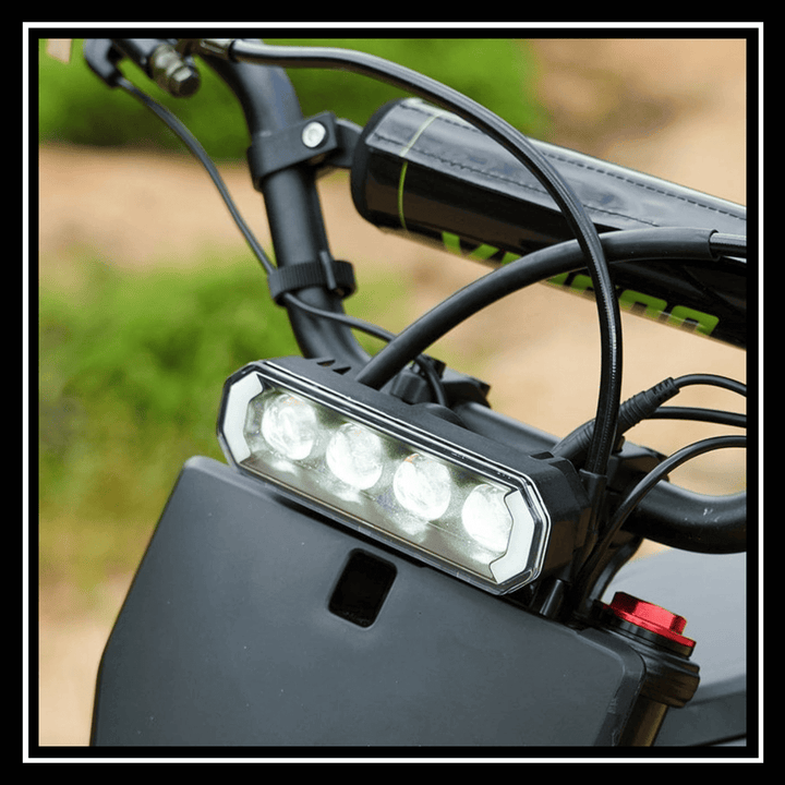 VIPCOO H3 3500W E-DIRT BIKE front LED headlight for enhanced visibility on off-road adventures.