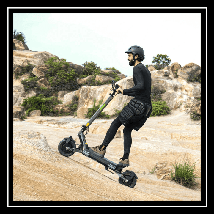 Rider using VS6 PRO ELECTRIC SCOOTER VIPCOO on rocky terrain, showcasing extreme power and off-road capability.