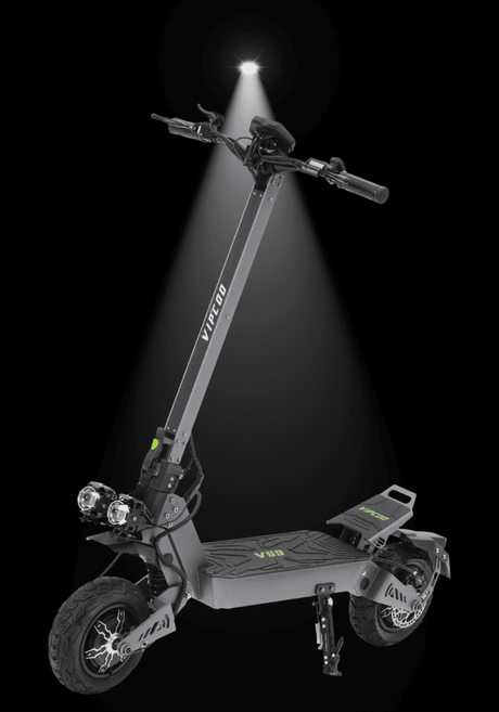 VIPCOO VS9 ELECTRIC SCOOTER illuminated against a dark background showcasing its design and features.