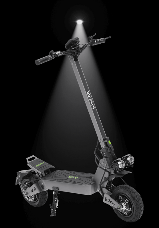 VIPCOO VS9 ELECTRIC SCOOTER illuminated against a dark background showcasing its design and features.