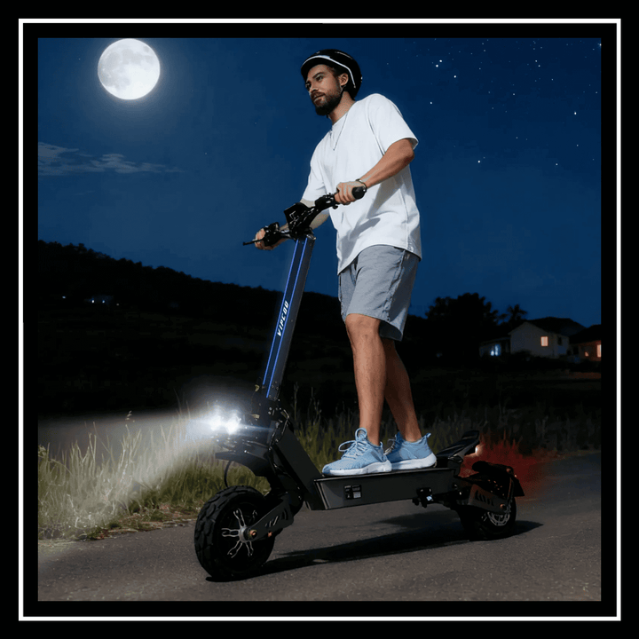 A man rides the ELECTRIC SCOOTER VIPCOO VS9 at night with bright lights under the moon.