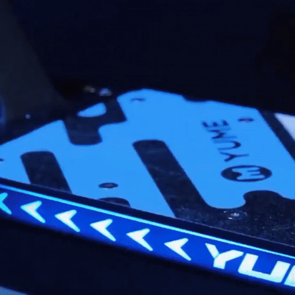 Close-up of the deck with YUME branding on the YUME HAWK electric scooter.