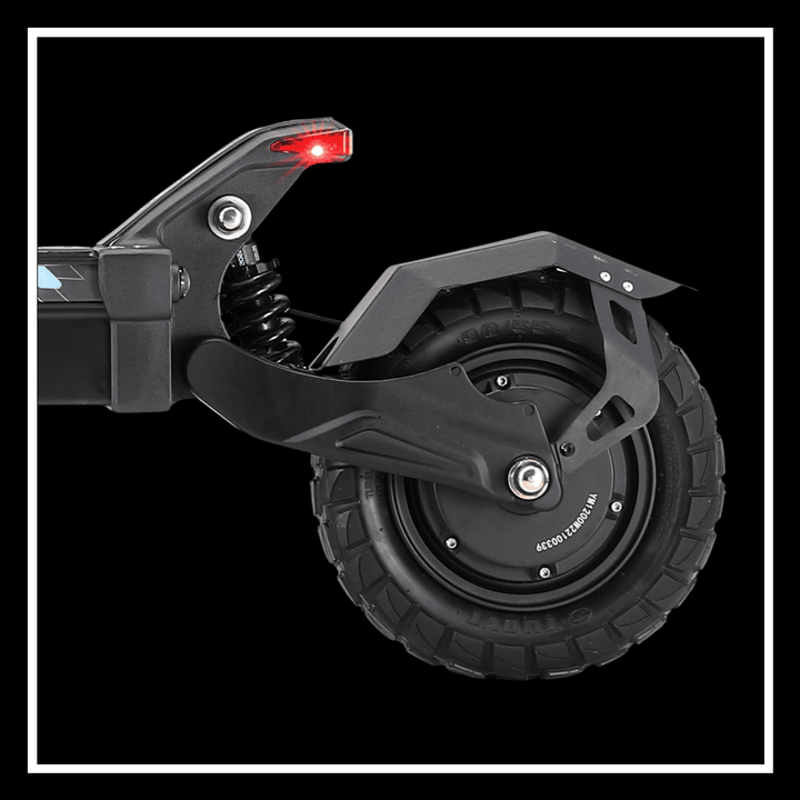 Close-up of YUME HAWK electric scooter rear tire showcasing durable design and suspension features.