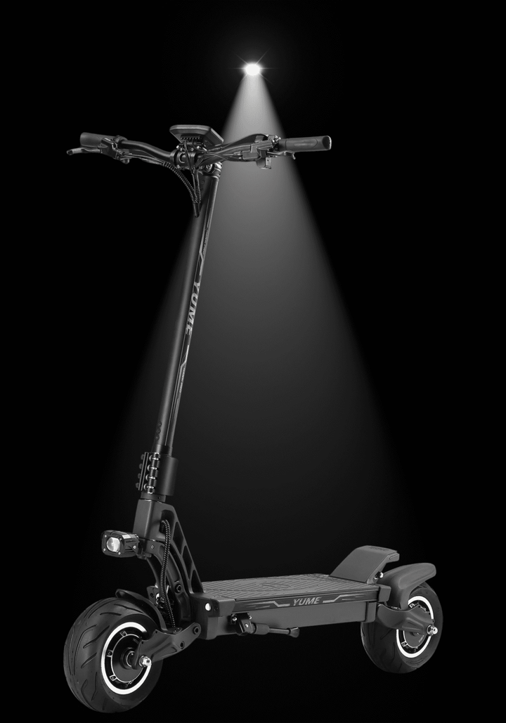 YUME Hawk Pro electric scooter featuring a high-performance design and bright front light in a dramatic spotlight.