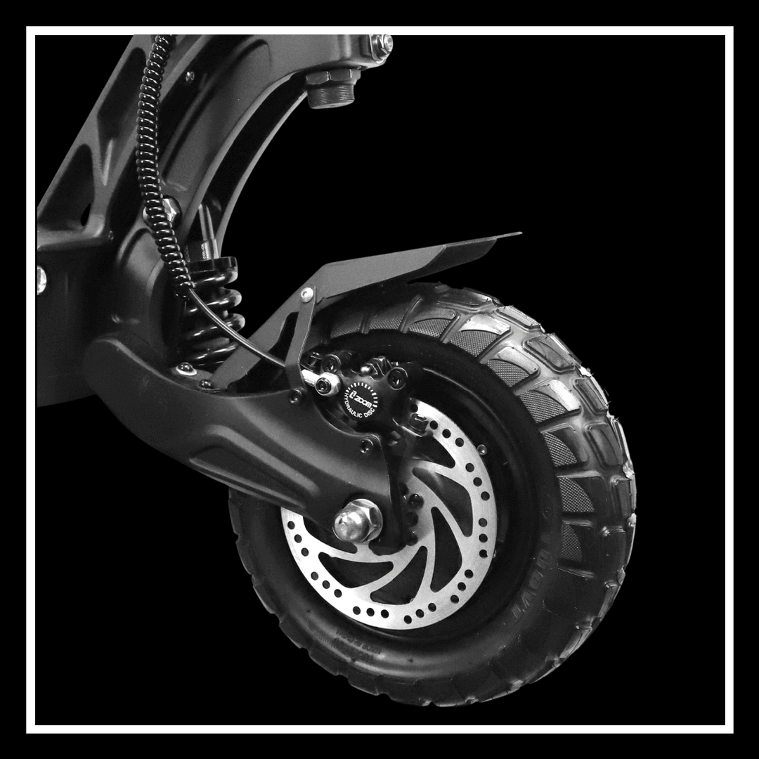 Close-up of the YUME Hawk Pro electric scooter's robust tire and brake system, showcasing durability and performance.