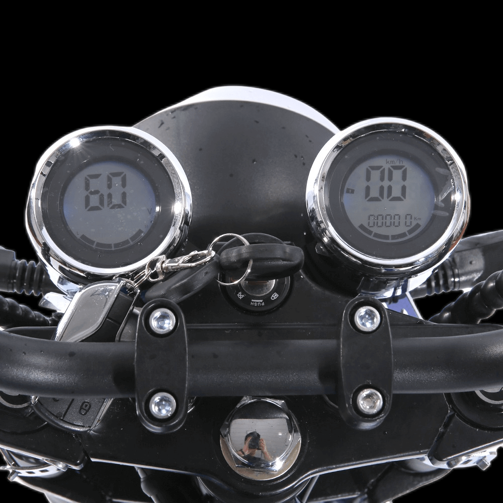 Close-up view of EAHORA M1P PLUS electric motorcycle dashboard with speedometer and odometer.