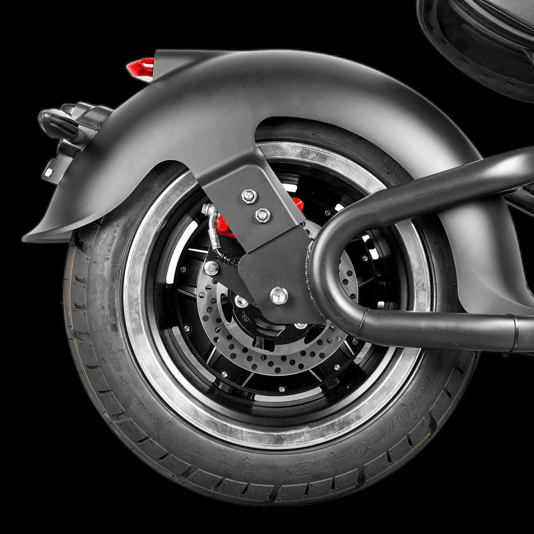 Close-up of the rear wheel of EAHORA M1P PLUS electric motorcycle showcasing the brake and tire details.