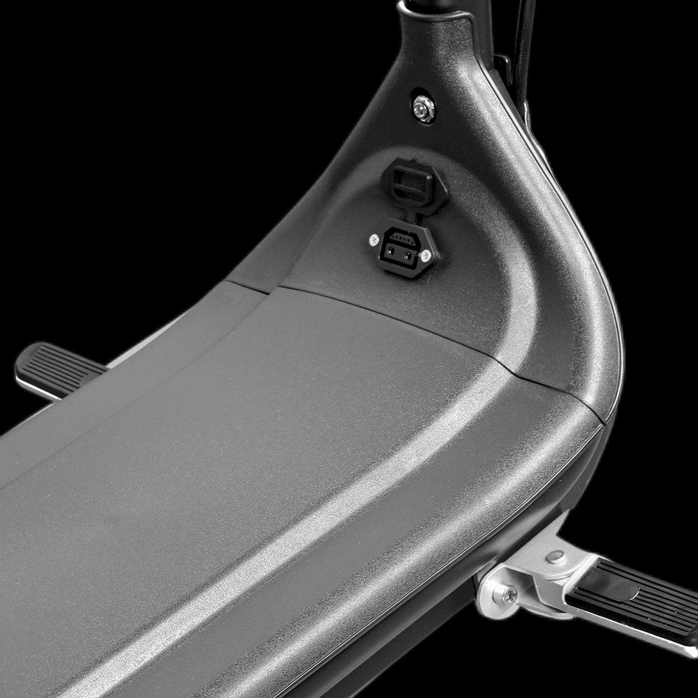 Close-up of the charging port on the EAHORA M1P PLUS electric motorcycle seat.