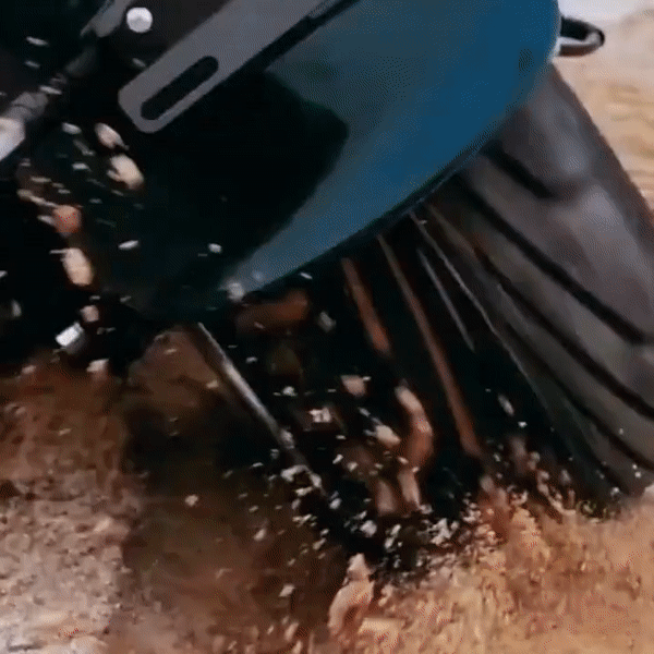 EAHORA M1P PLUS electric motorcycle rear tire kicking up dirt while riding on rough terrain.