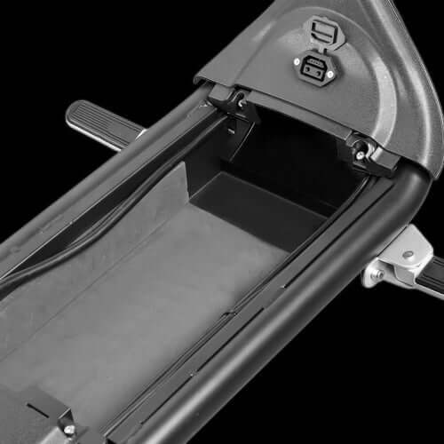 M1P electric chopper motorcycle storage compartment view showing charging port and interior details.
