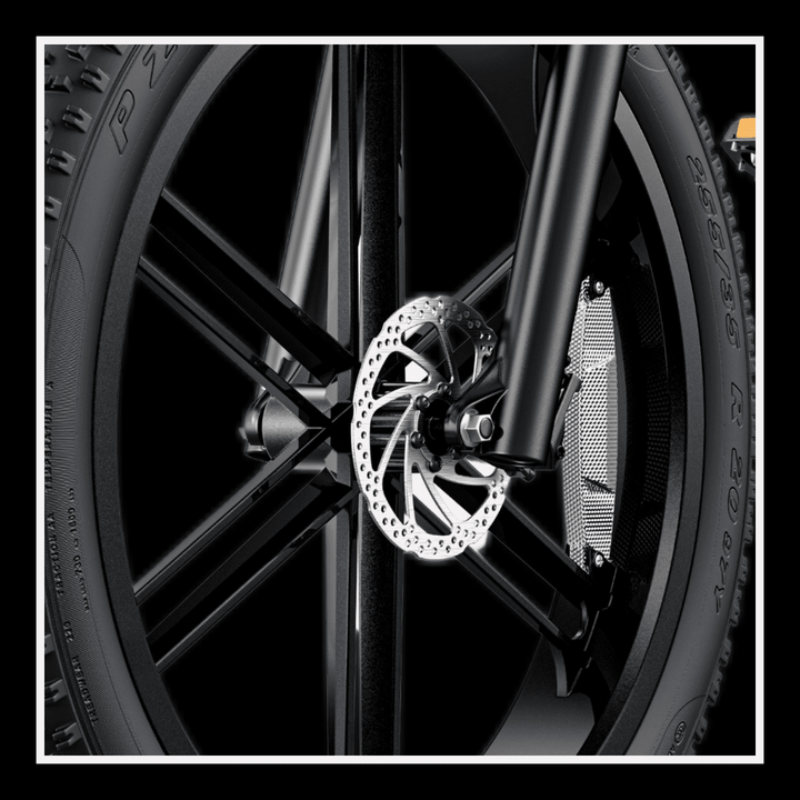 Close-up view of the front wheel and disc brake system of the Engwe X26 electric bike.