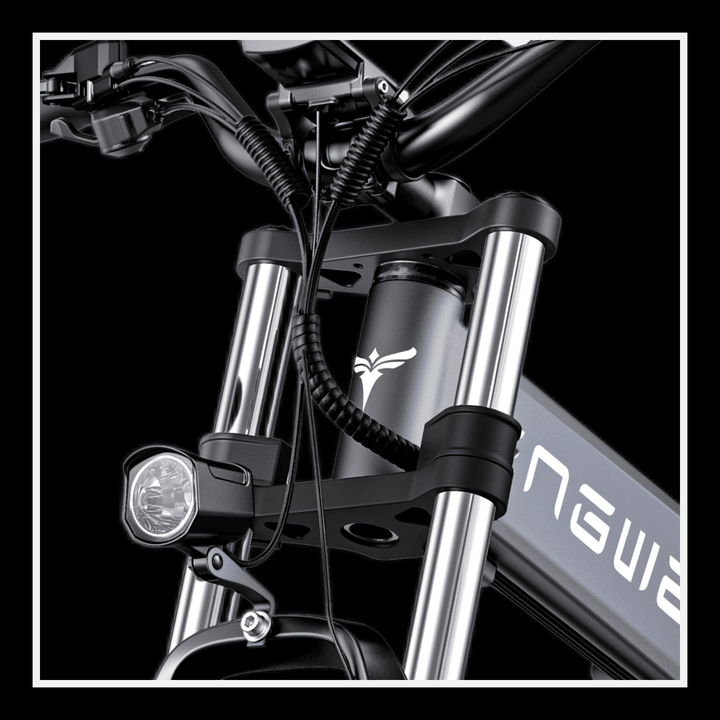 Close-up of the handlebars and headlight on the Engwe X26 electric bike, showcasing its sleek design and components.
