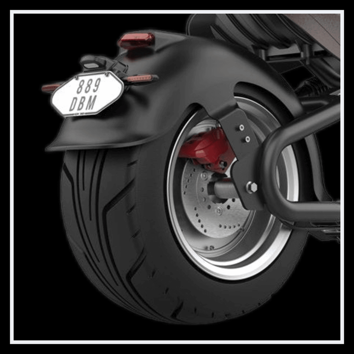 Rear view of INTHEZONE M8S electric motorcycle showcasing rear wheel and brake details.