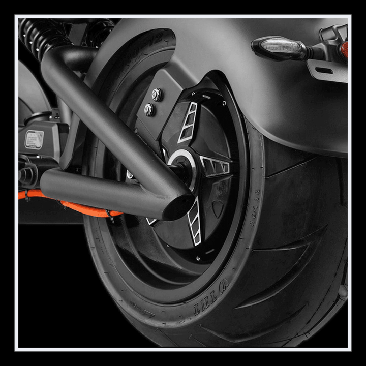 Close-up of INTHEZONE M1PS electric motorcycle rear wheel showcasing its design and tire.