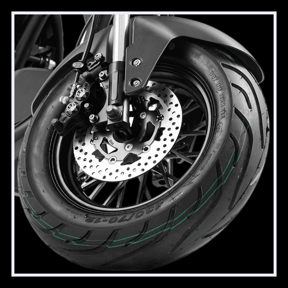 INTHEZONE M1PS electric motorcycle front tire and brake system close-up view