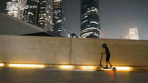 KUKIRIN G2 MAX electric scooter in action, showcasing its performance in an urban setting at night.