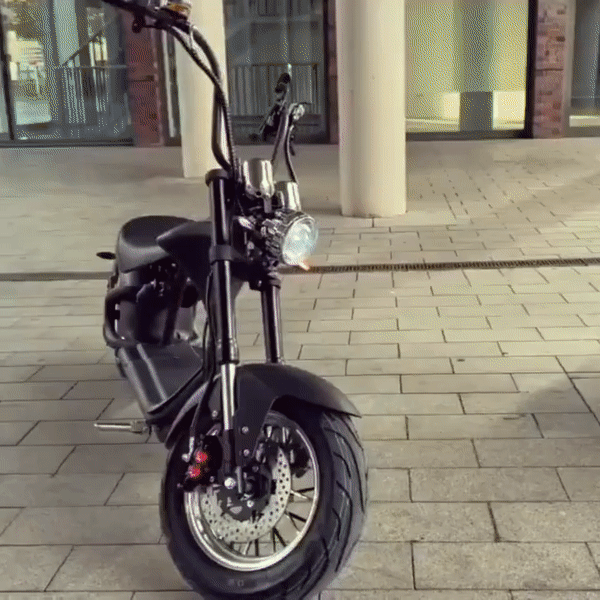M1P electric chopper motorcycle showcasing sleek design and performance on urban pavement.