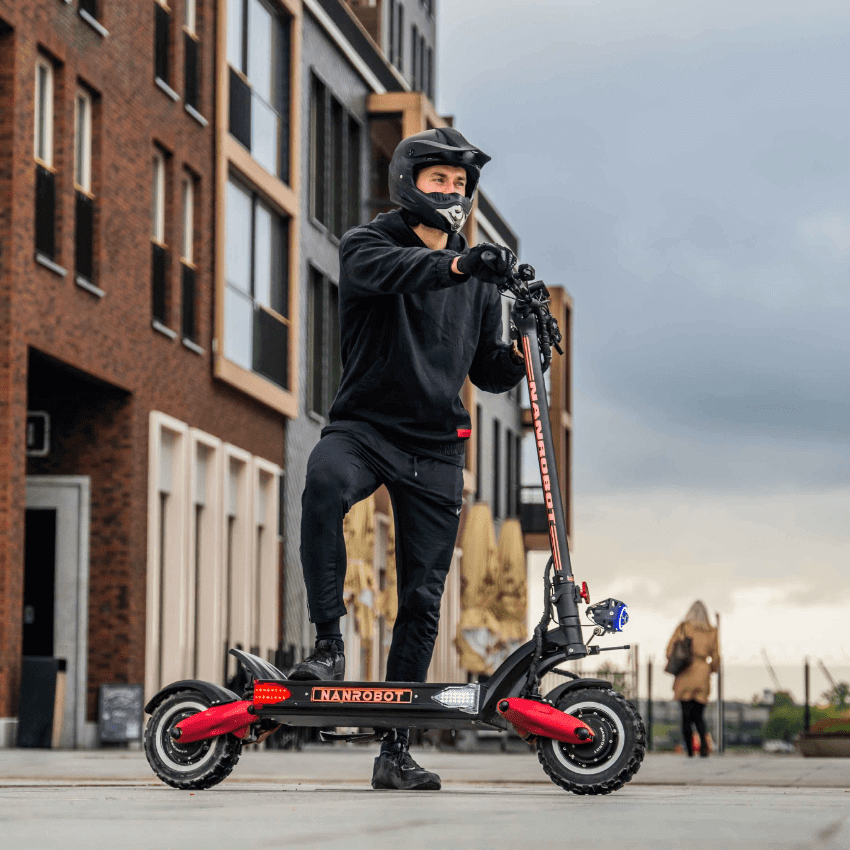 Rider on a Nanrobot LS7+ electric scooter showcasing its sleek design and performance.